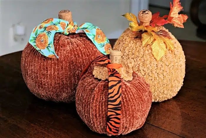 upcycled sweater pumpkins with wine cork stems.