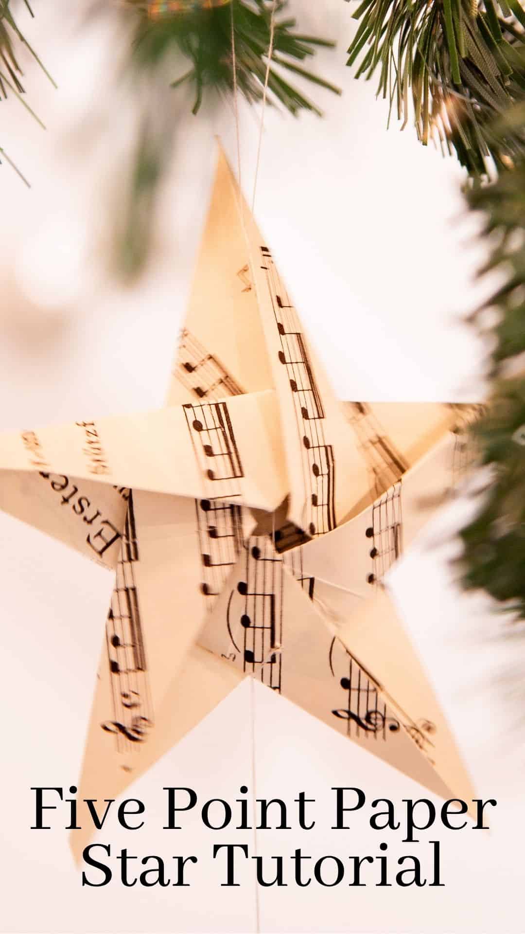 A paper star folded from sheet music paper. With text overlay five point paper star tutorial.