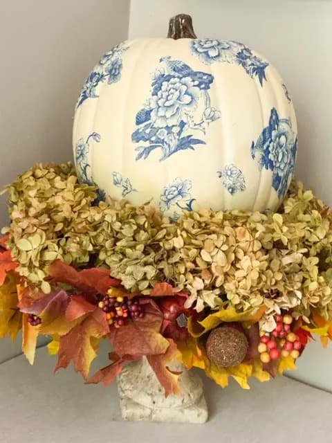 Decoupage white pumpkin with blue chinoiserie flower decor.
