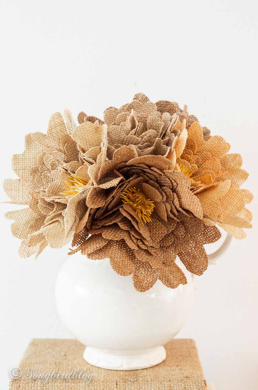DIY burlap flowers bouquet in white vase.