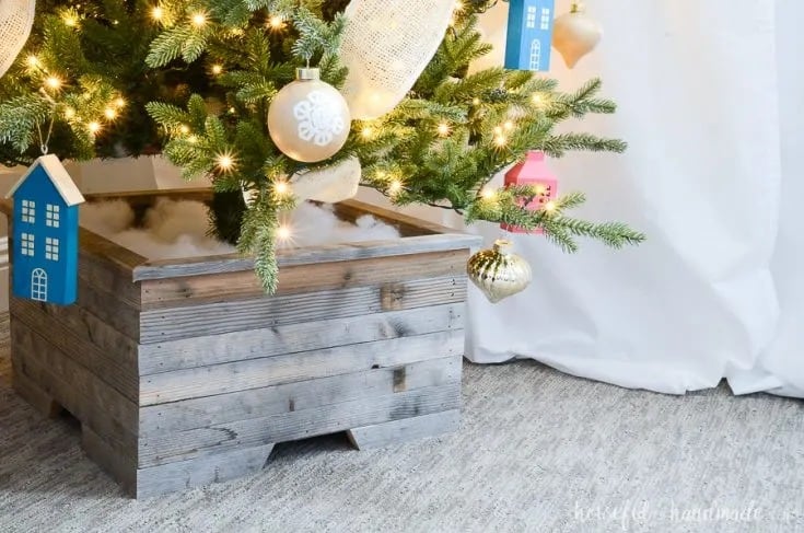 DIY wooden Christmas tree skirt made to hide the tree stand.