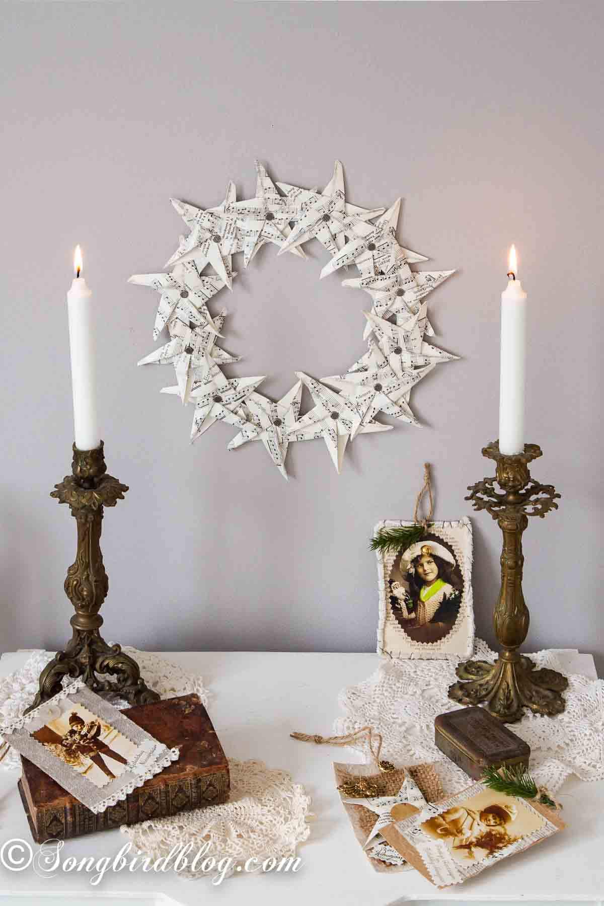 Paper star wreath from vintage music paper on a styled wall vignette.