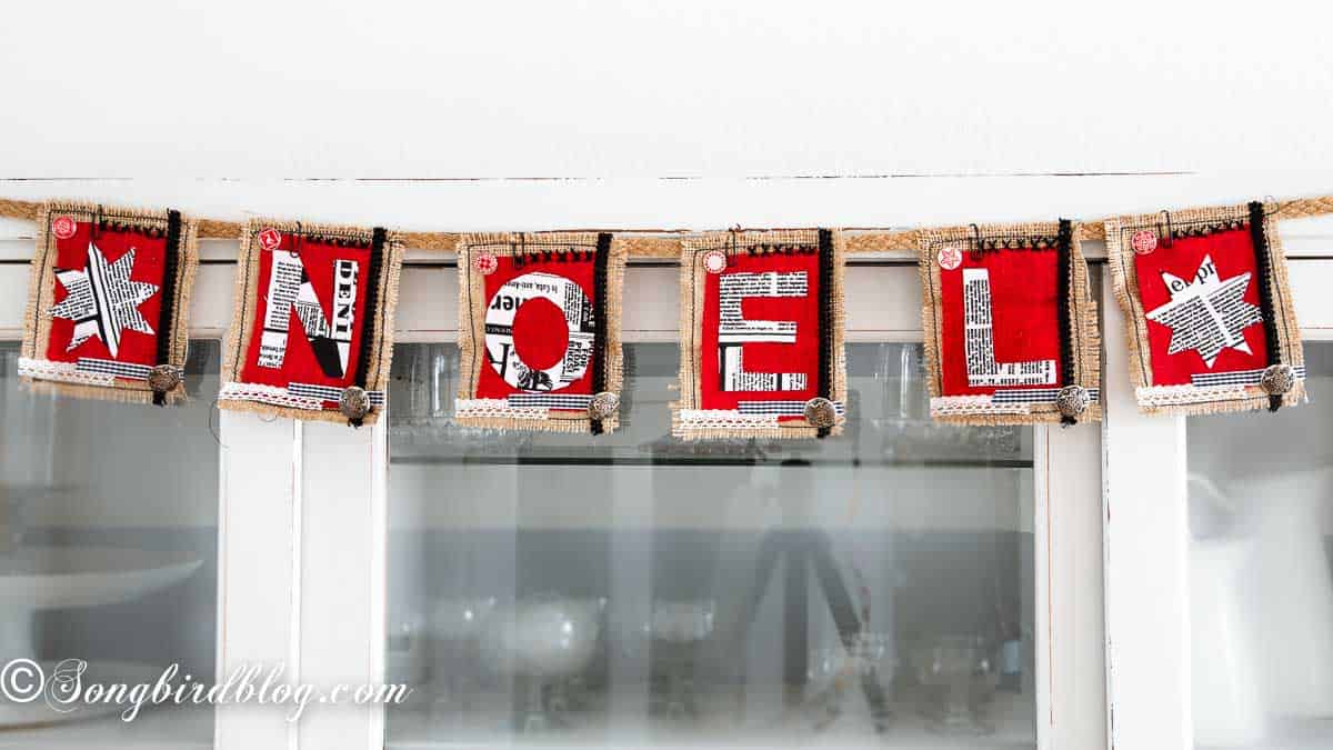 Mixed media banner with letters NOEL.