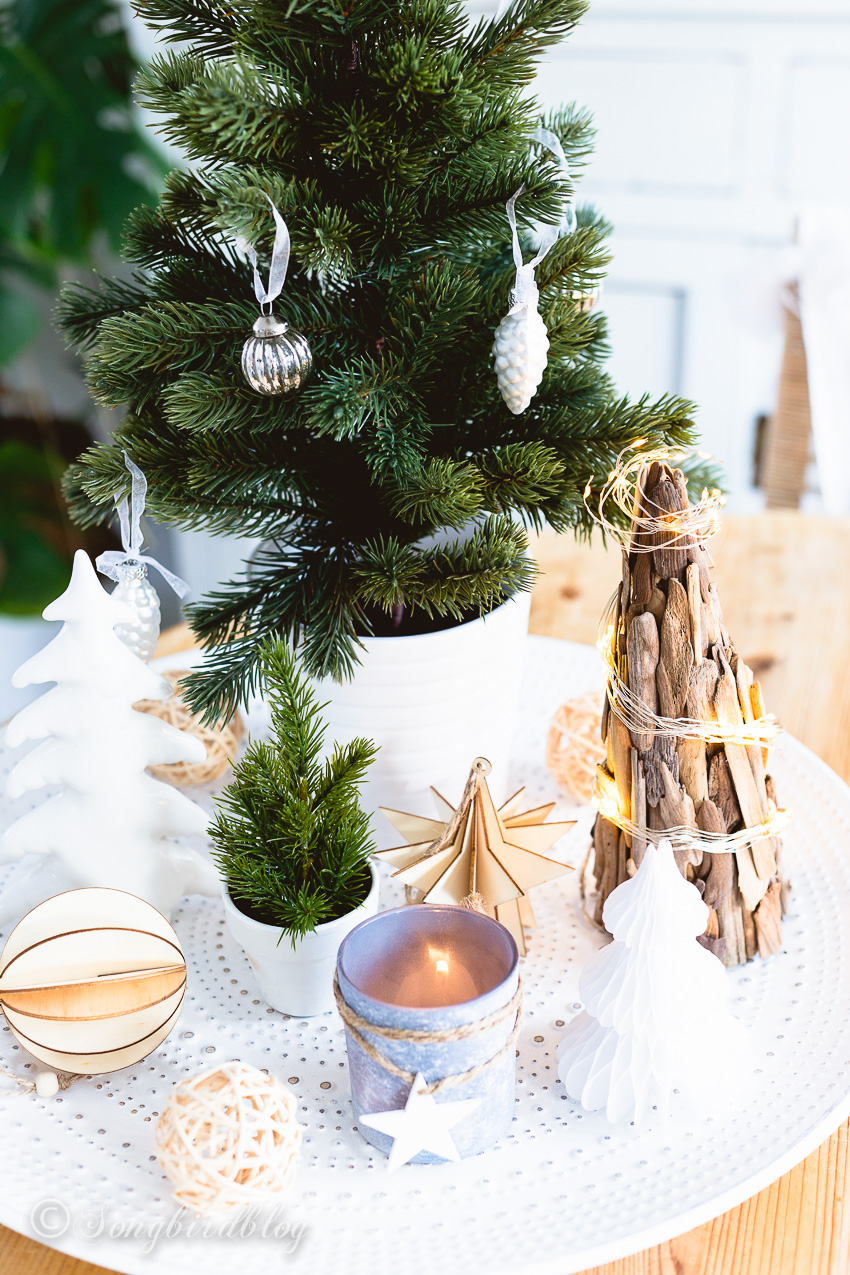 A tray filled with Christmas decorations.