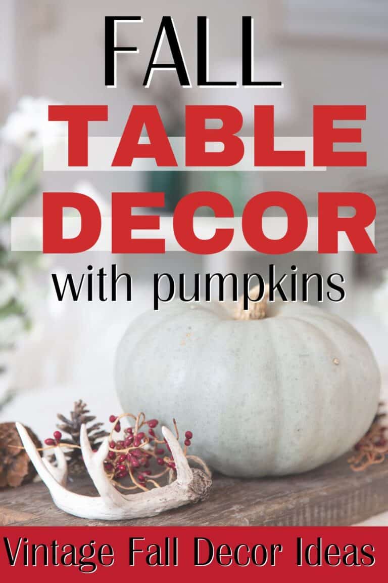 Soft muted image of a green heirloom pumpkin on a brown breadboard with text overlay Fall Table Decor with Pumpkins - vintage fall decor ideas.
