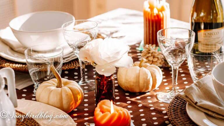 Fall and thanksgiving table setting in tones of brown and orange.
