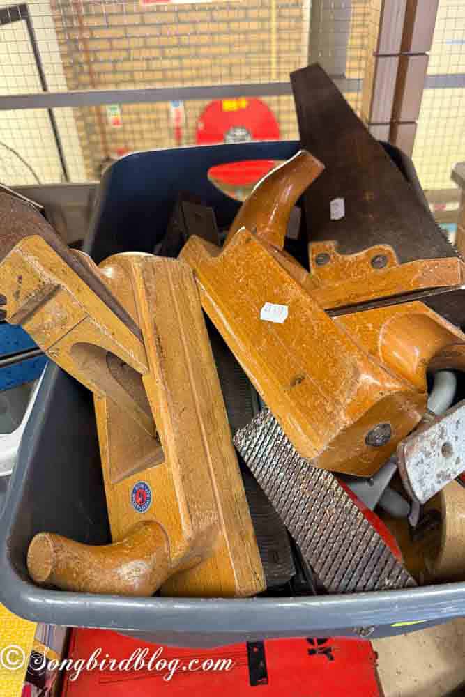 At the thrift store: a box full of old wooden hand tools.