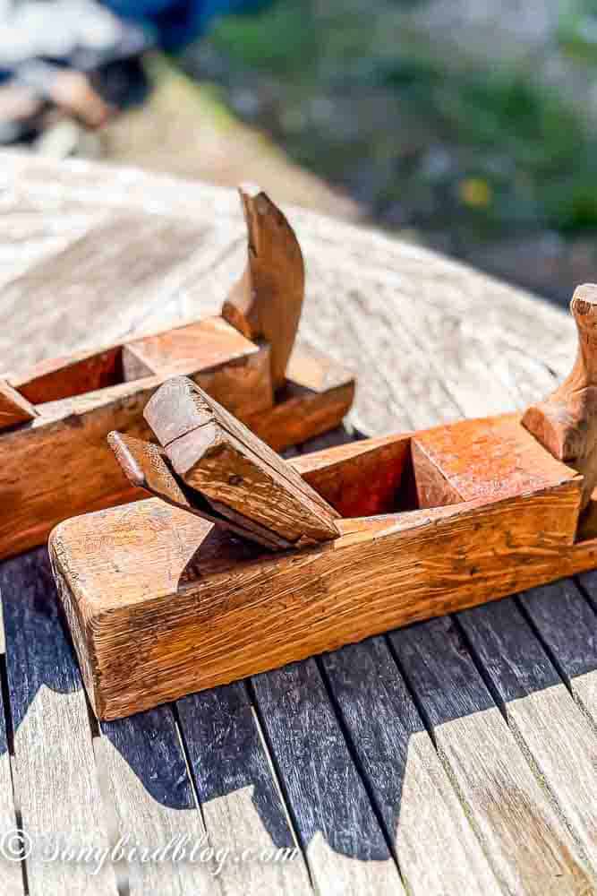 Two vintage wooden hand planers, washed and drying in the sun.